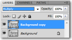 Choose Multiply from the blending modes list on the top row of the Layers panel.